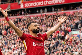 Mohamed Salah celebrates after scoring a penalty for Liverpool during the Premier League match against Southampton at Anfield in Liverpool, England on 8 March, 2025.