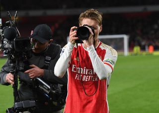 Arsenal captain Martin Odegaard takes pictures after the Premier League match between Arsenal FC and Liverpool FC at Emirates Stadium on February 04, 2024 in London, England. (Photo by Stuart MacFarlane/Arsenal FC via Getty Images)