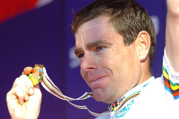 Evans' displays his medal to the assembled masses.
