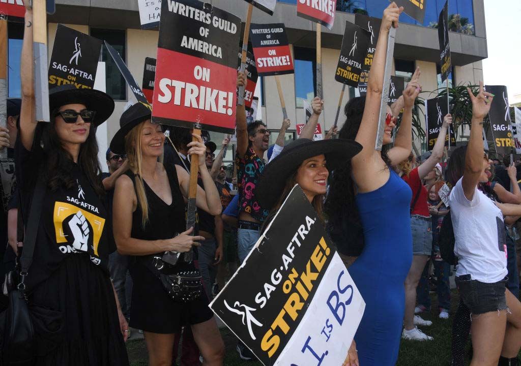 Writers Guild of America and SAG-AFTRA members picket outside Netflix in Hollywood on Aug, 14.