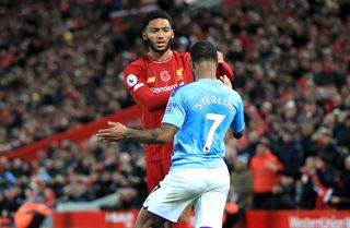 Raheem Sterling clashes with Joe Gomez, left, in Manchester City’s defeat to Liverpool