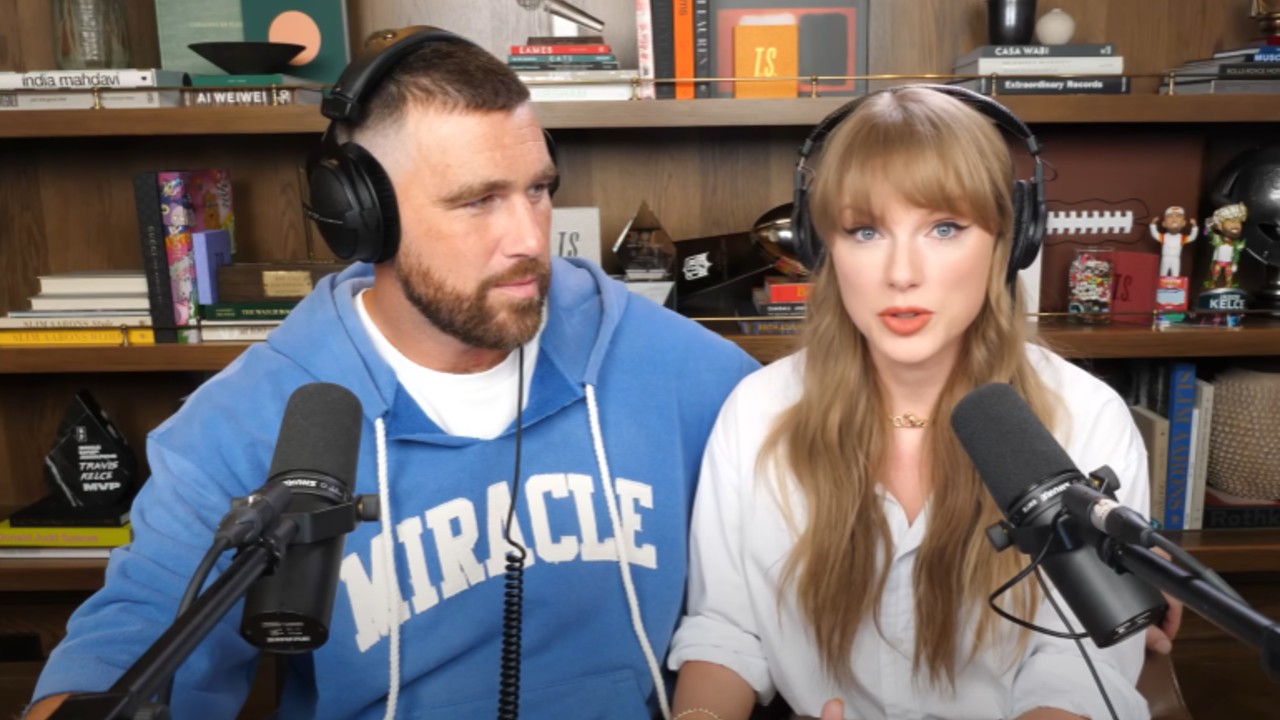 From left to right: Travis Kelce looking lovingly at Taylor Swift while she talks and looks int othe camera on New Heights.