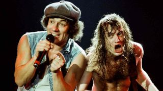 AC/DC’s Brian Johnson and Angus Young performing onstage in 1988