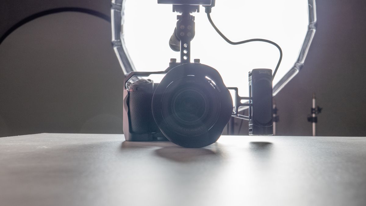 A backlit photo of a Nikon Z7 II camera with a studio light behind it. The image has been brightened in post production software.