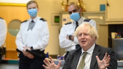 Boris Johnson during a visit to Uxbridge police station