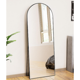 arched floor mirror with a thin black frame and leaning stand