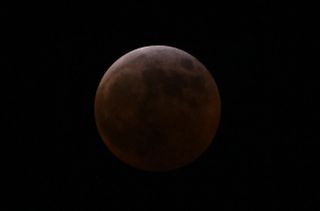 deep red moon during the total lunar eclipse