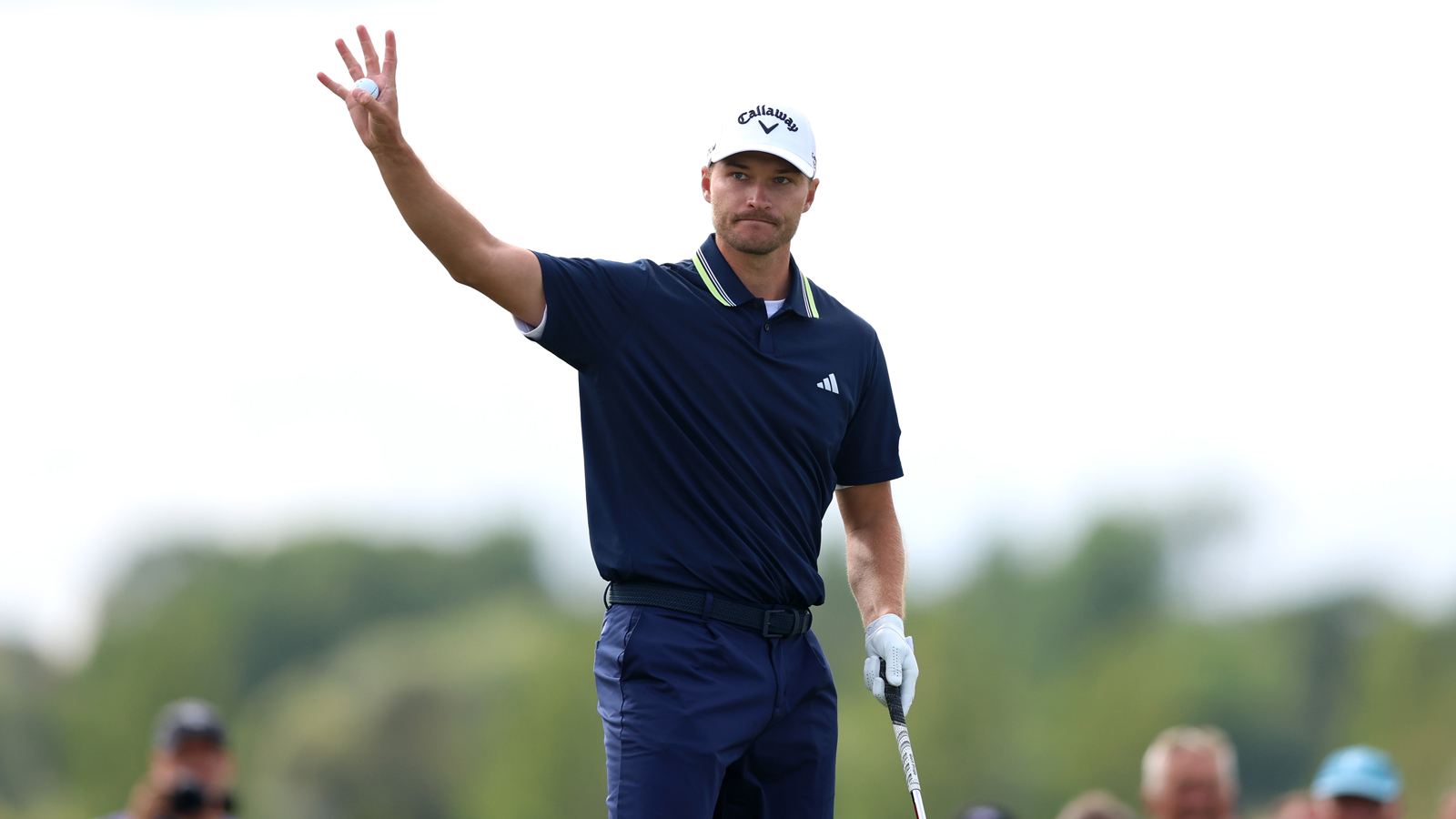 Rasmus Hojgaard waves to the crowd