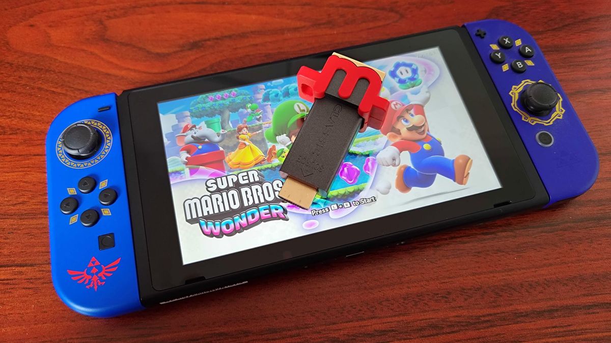 mClassic dongle sitting on top of Nintendo Switch with Super Mario Odyssey on screen