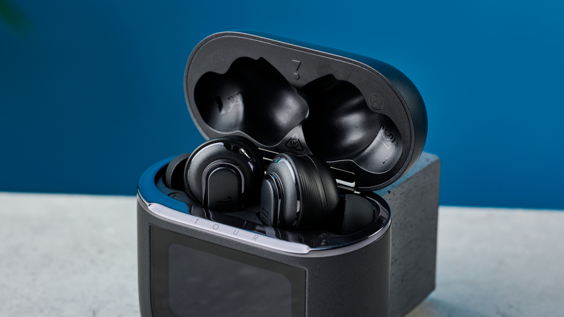 A pair of JBL Tour Pro 2 wireless earbuds in black