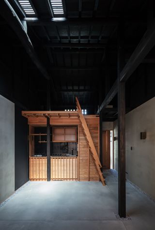 Timber mezzanine structure inside japanese house by Atelier Luke