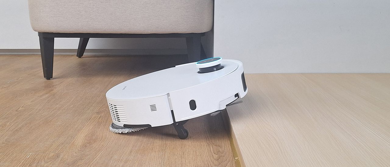 Dreame X50 Ultra robot vacuum climbing over a step
