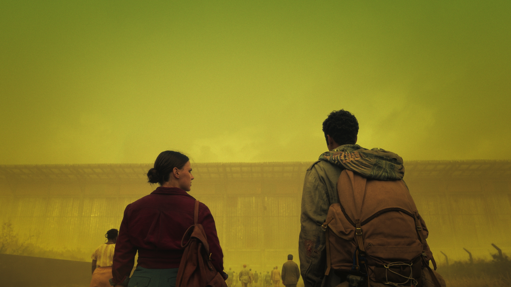 Lyra and Will Parry outside a massive building in His Dark MAterials season 3