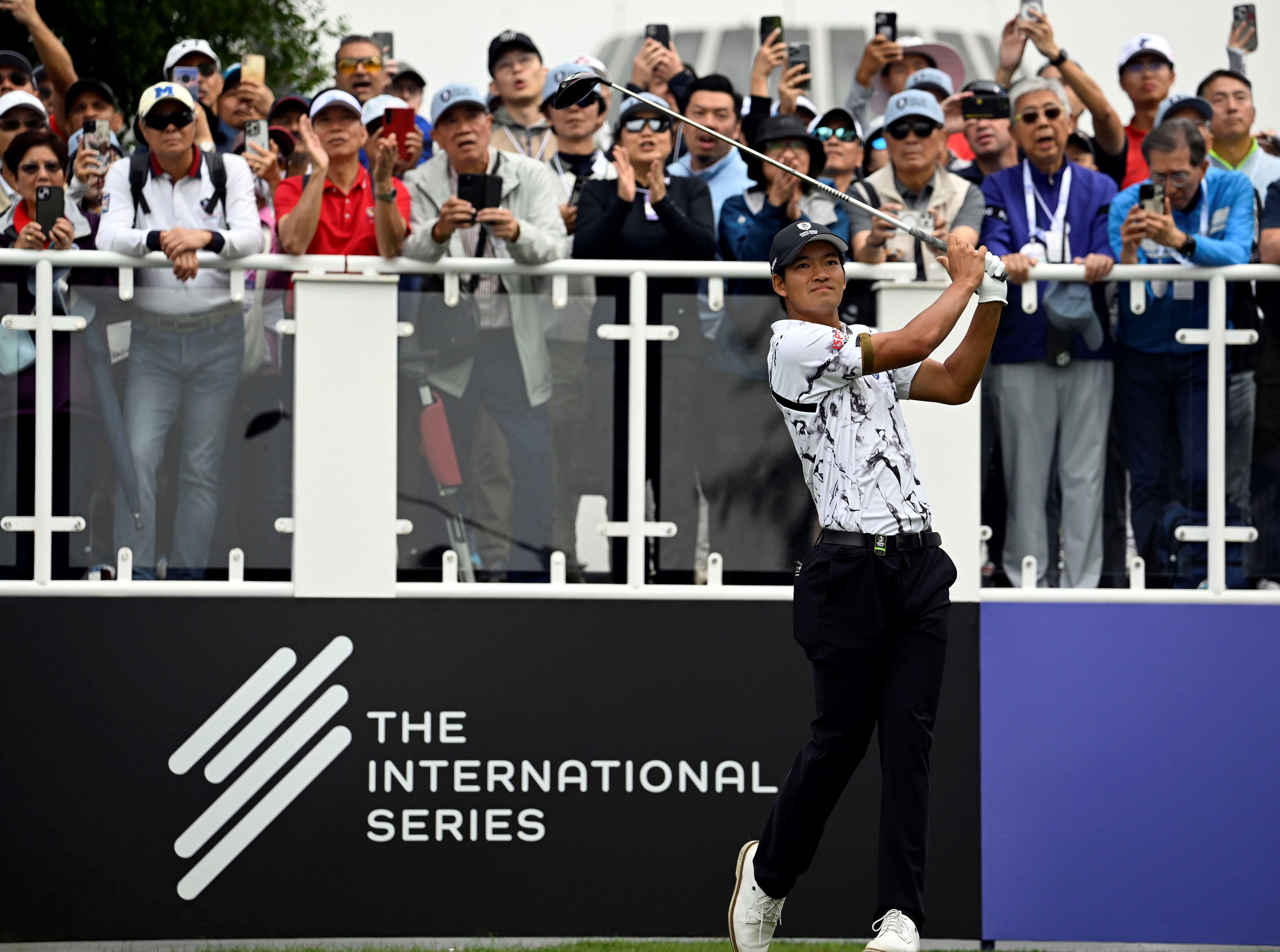 Taichi Kho plays a tee shot at an International Series tournament