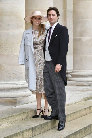 Princess Beatrice and Edoardo Mapelli Mozzi in a floral dress and suit at a wedding