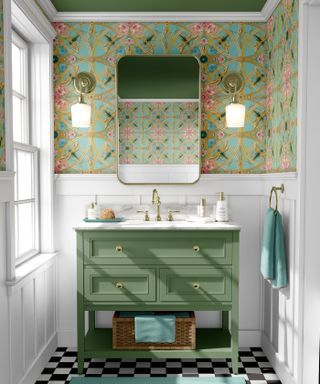 Colored bathroom trend, green sink and wallpaper