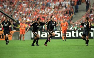 Real Madrid players celebrate a goal against Valencia in the 2000 Champions League final.