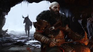 God of War: Ragnarok Kratos in a cave in front of a fire