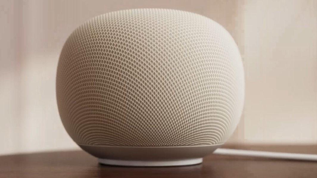 Google Home smart speaker in Porcelain on a wooden surface