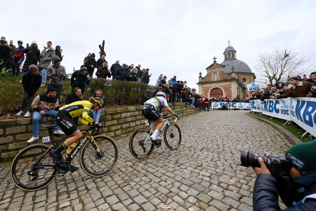 NINOVE, BELGIUM - FEBRUARY 24: (L-R) Marianne Vos of The Netherlands and Team Visma | Lease A Bike and Lotte Kopecky of Belgium and Team SD Worx-Protime compete in the breakaway climbing the Muur van Geraardsbergen while fans cheer during the 16th Omloop Het Nieuwsblad 2024, Women&amp;amp;apos;s Elite a 127.1km one day race from Ghent to Ninove / #UCIWWT / on February 24, 2024 in Ninove, Belgium. (Photo by Alex Broadway/Getty Images)