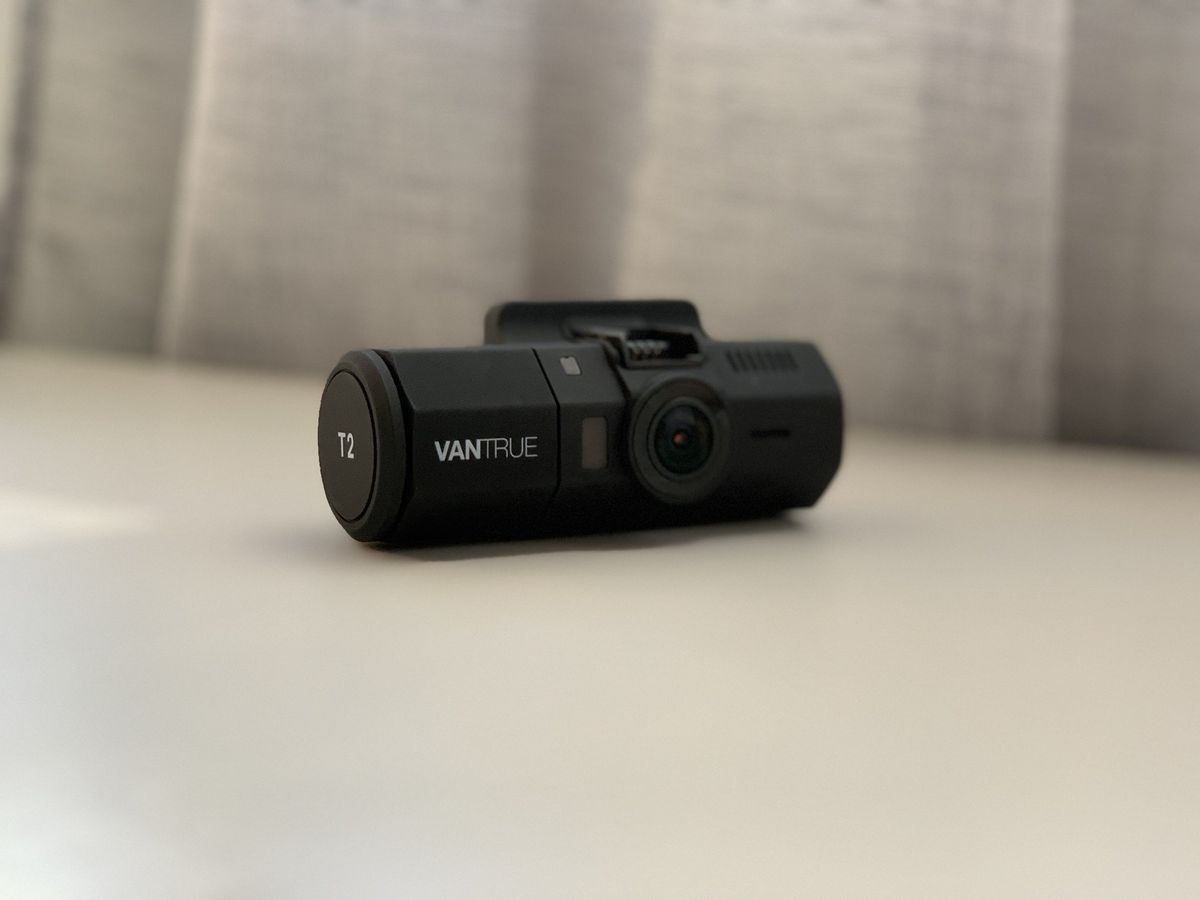 Vantrue T2 Dash Cam detached on table at an angle to see the front