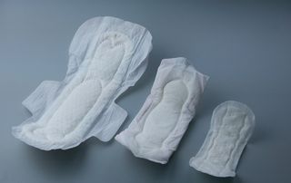 Three sizes of sanitary towels
