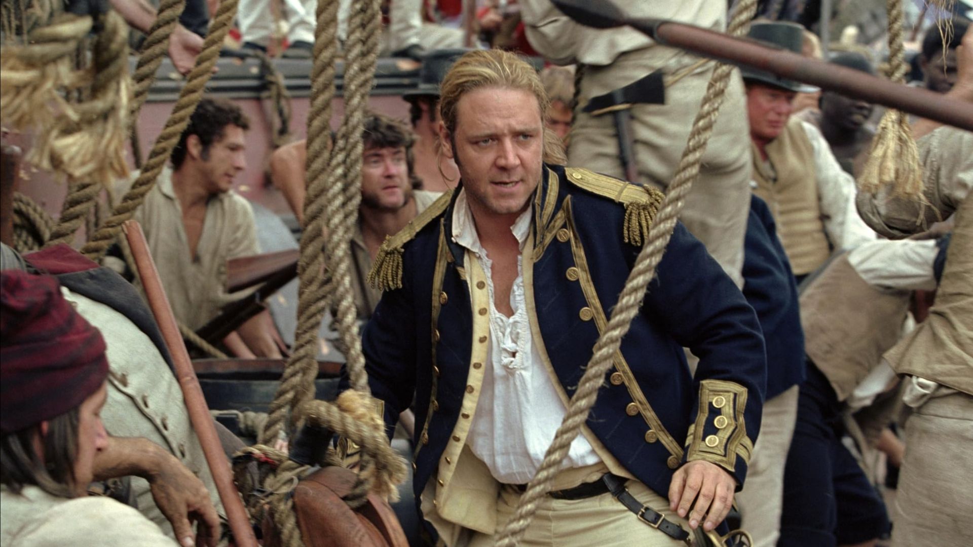 an image of Russel Crowe in character on board a ship in the film
