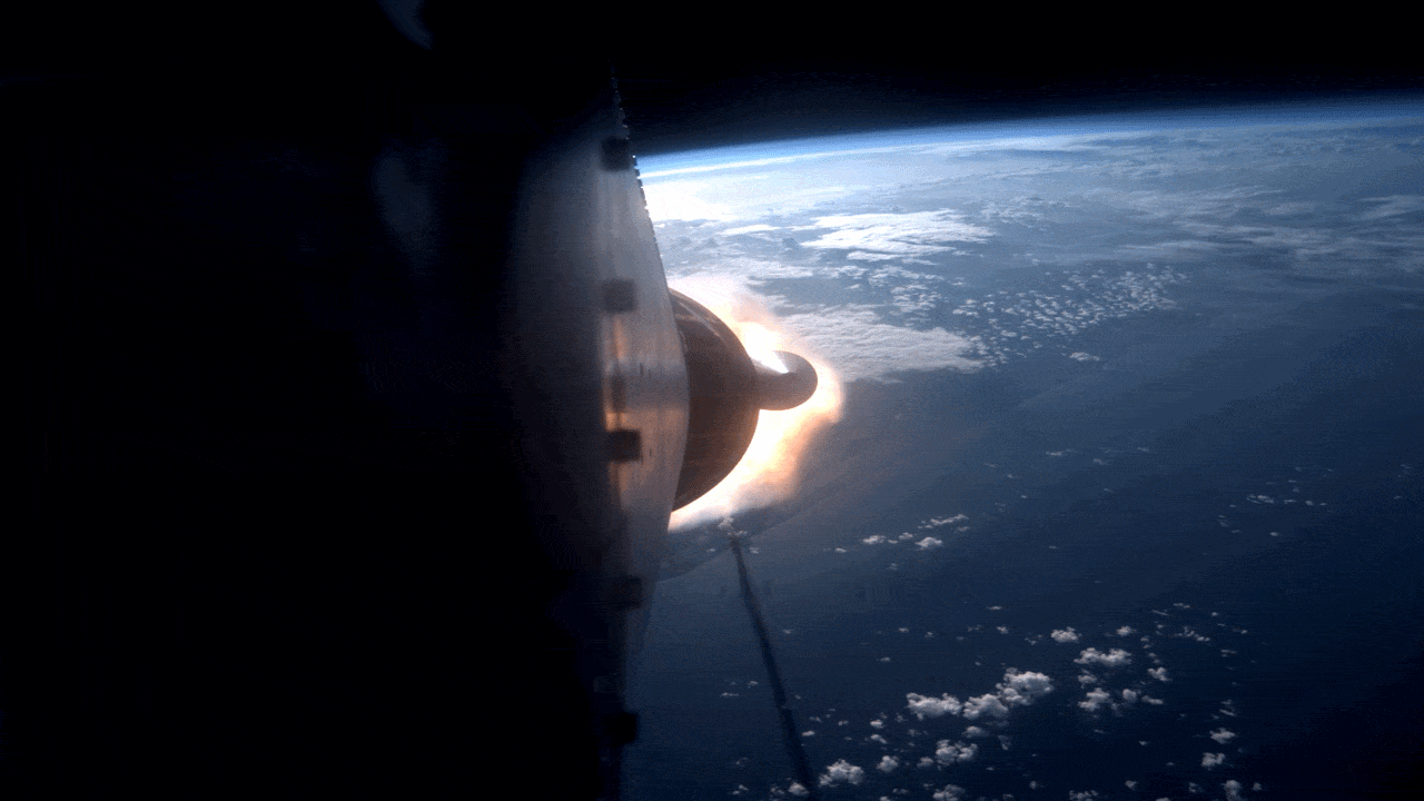 A view from a rocket ship as boosters eject with a fiery blast, headed back to Earth.
