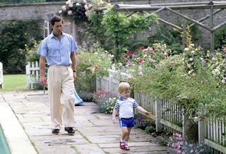 Prince Charles and Prince Harry as a toddler in the garden of Highgrove