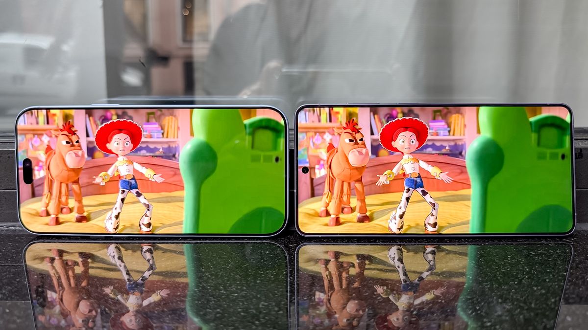 The iPhone 18 Pro Max and Galaxy S26 Ultra side by side showing Toy Story 5 on their displays