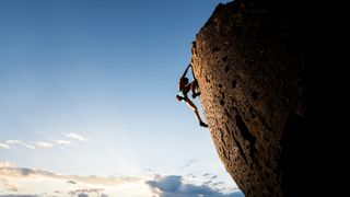 Climber on sheer rock face