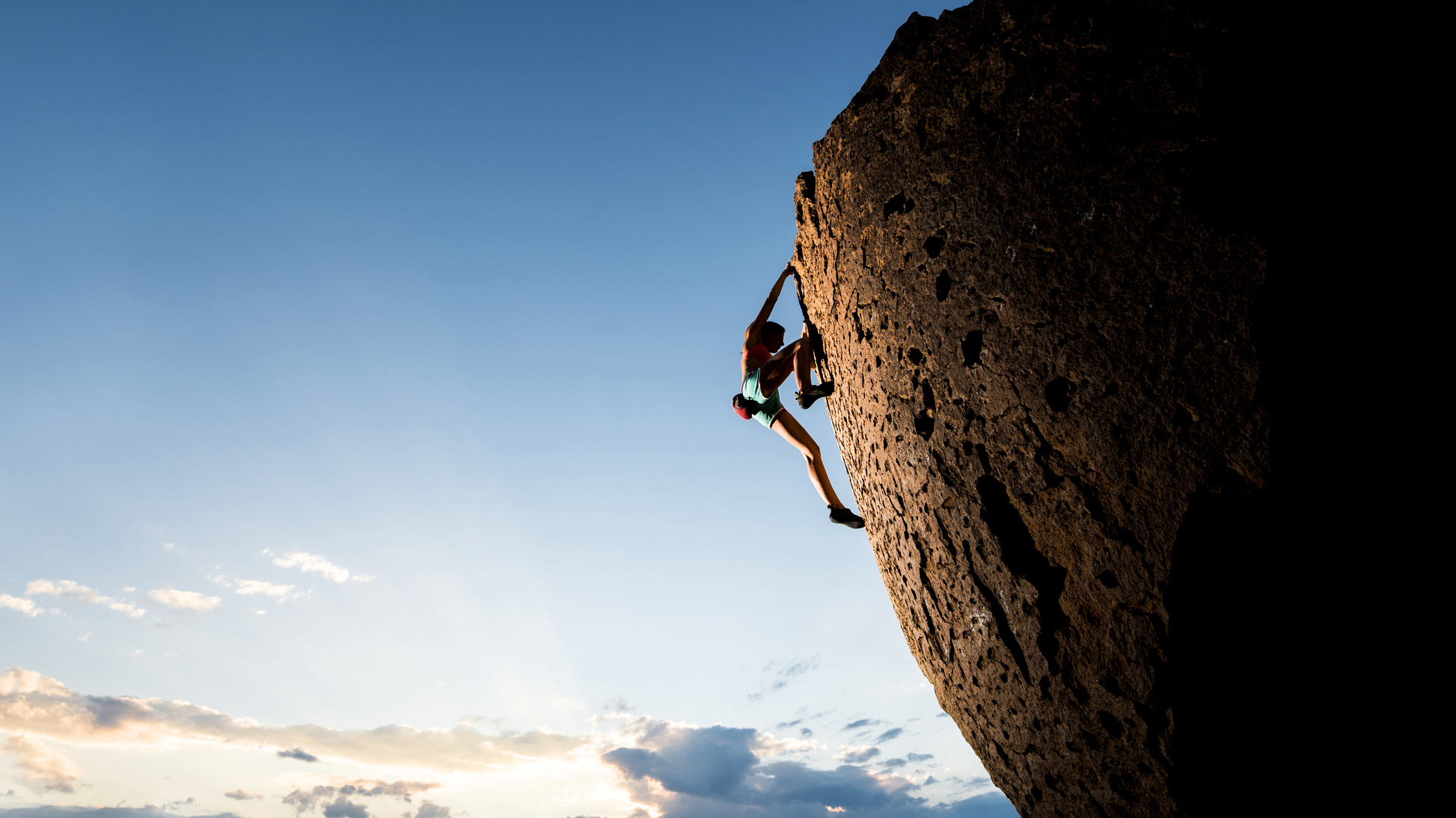Climber on sheer rock face