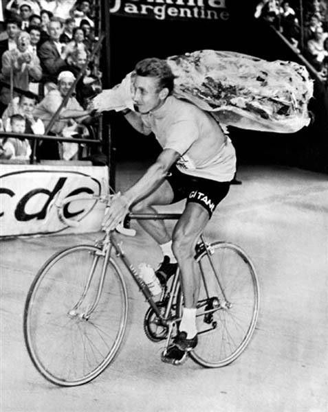 Frenchman Jacques Anquetil does a victory lap at the Parc des princes in Paris after capturing his fourth Tour de France on July 14, 1963. Anquetil previously won in 1957, 1961 and 1962.