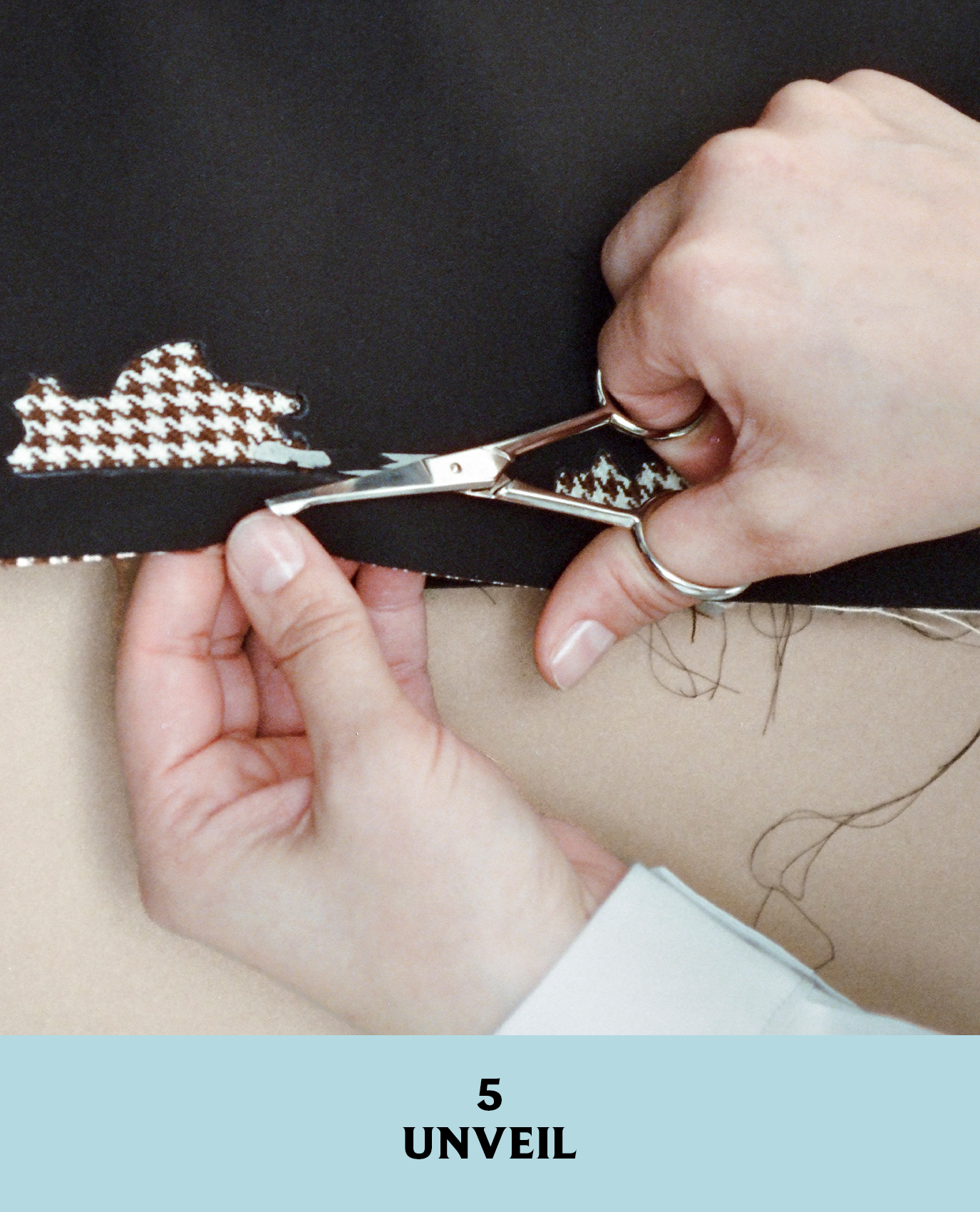 Prada artist cutting fabric for the jacket from Look 10 in its fall/winter 2026 collection.