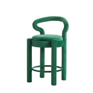 A green velvet bar stool
