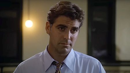 George Clooney wearing a collared shirt and tie on ER (1994).