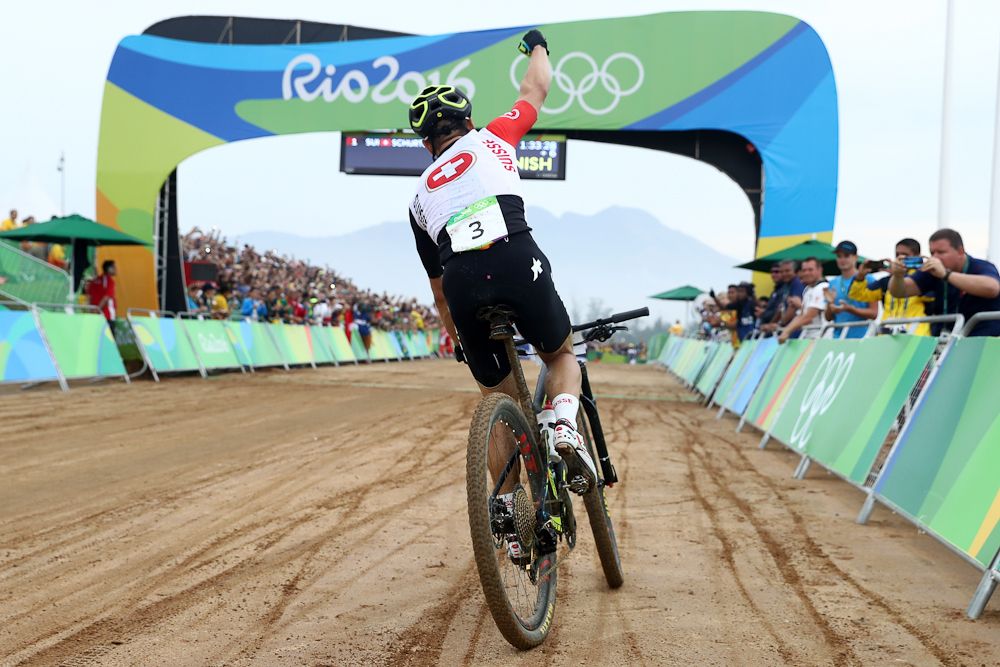 Nino Schurter celebrates his Olympic gold medal