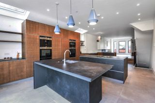 a kitchen with a double island idea