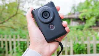 A black Canon PowerShot V10 vlogging camera