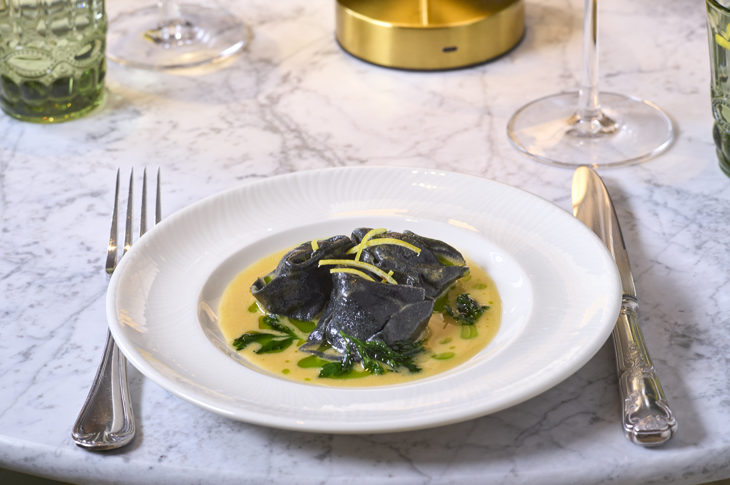 Orkney crab tortelli, charcoal pasta, langoustine &amp;amp; parsley butter sauce at Tortello restaurant, Royal Lancaster hotel, London