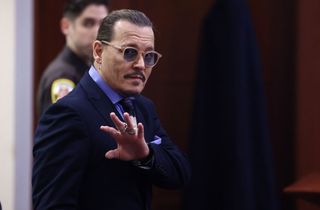 US actor Johnny Depp leaves for a recess at the Fairfax County Circuit Courthouse in Fairfax, Virginia, on May 5, 2022. - Actor Johnny Depp is suing ex-wife Amber Heard for libel after she wrote an op-ed piece in The Washington Post in 2018 referring to herself as a public figure representing domestic abuse. (Photo by JIM LO SCALZO / POOL / POOL / AFP) (Photo by JIM LO SCALZO / POOL/POOL/AFP via Getty Images)