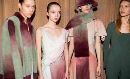 Models are seen wearing ombre fur scarfs and coats, paired with layered crepe dresses and tops