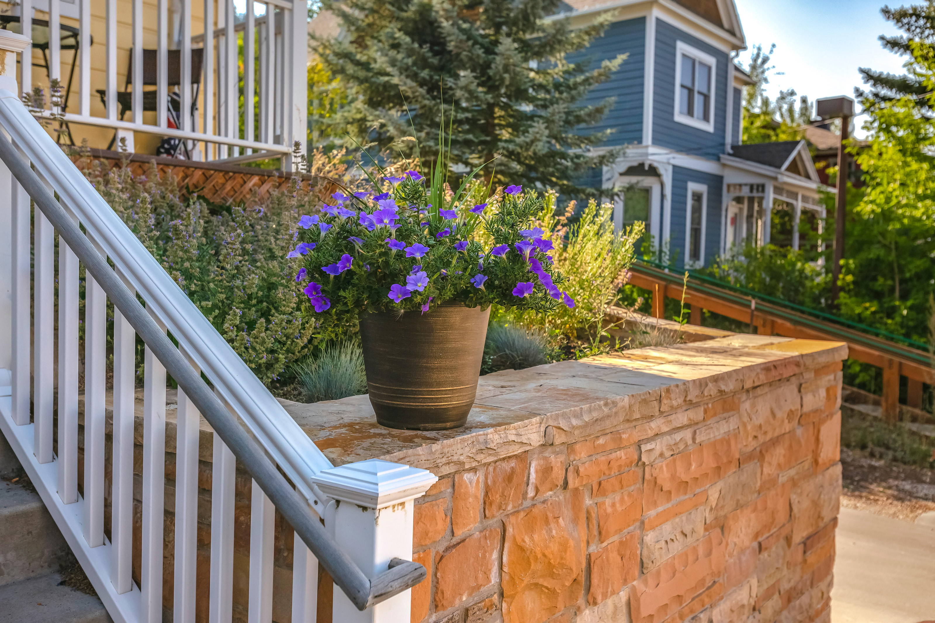 front garden wall ideas: brick wall with steps leading up to a front porch