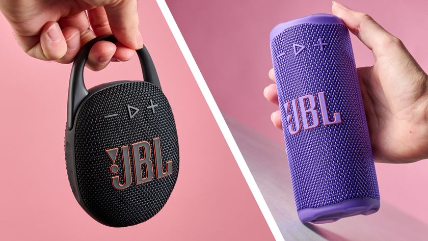 A hand is holding the JBL Clip 5 by its carabiner, and someone holds the JBL Grip in their hand, with their thumb resting on top.