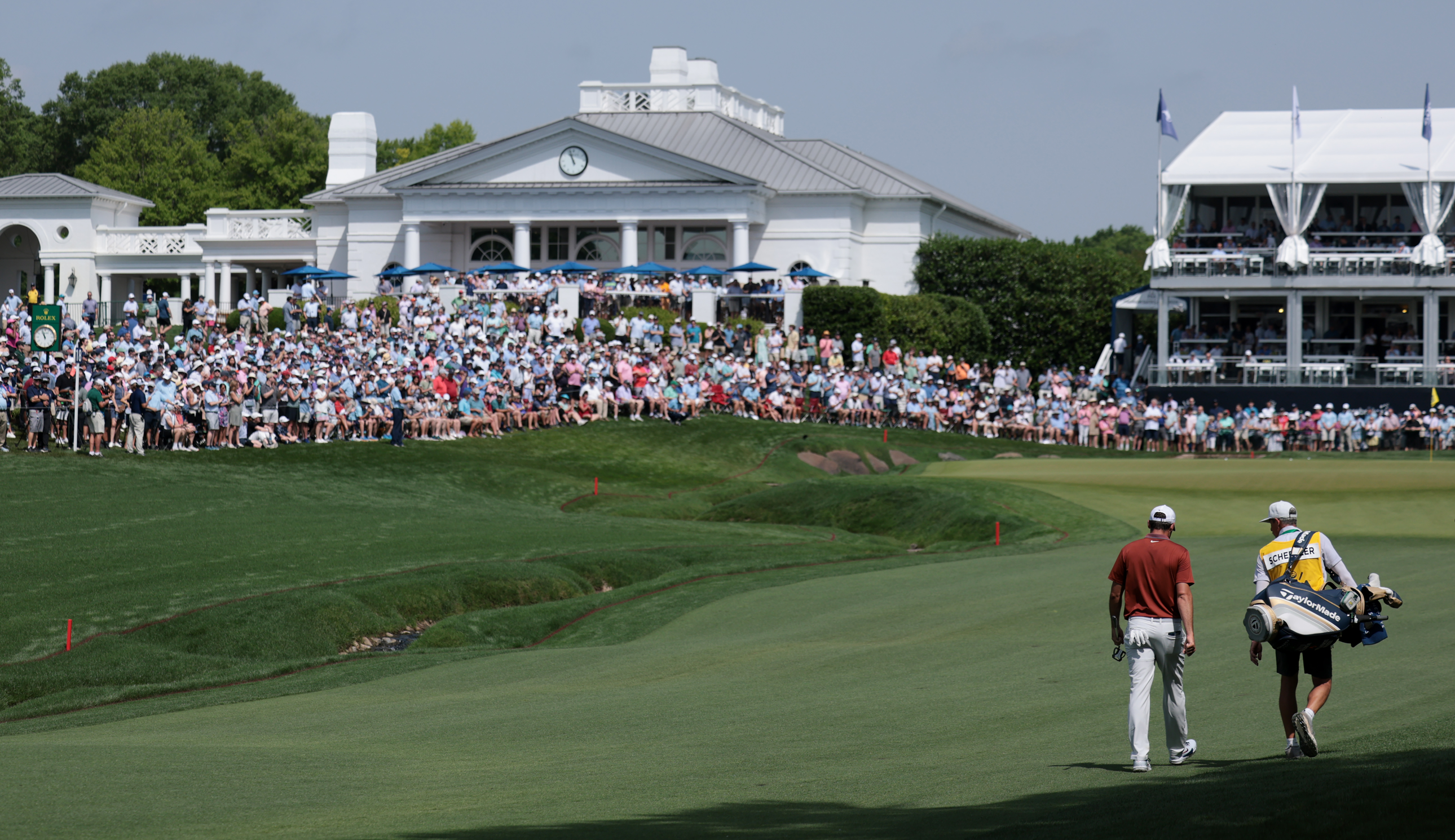 Scottie Scheffler walks up the fairway at Quail Hollow