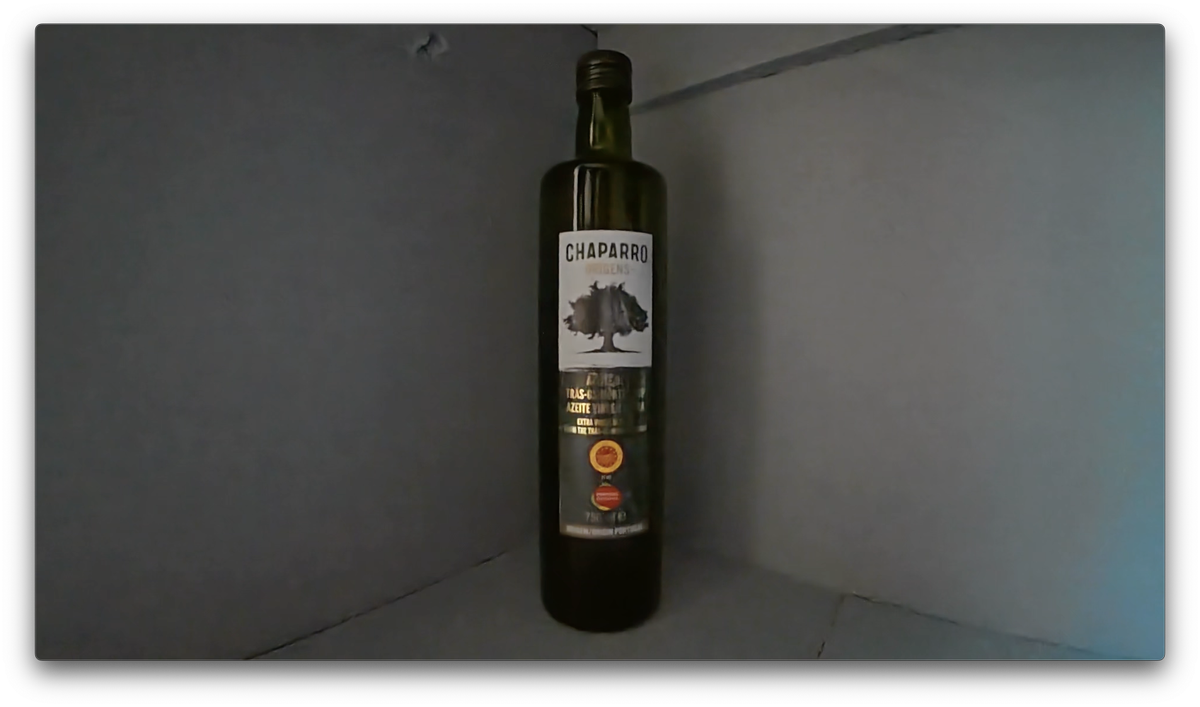 A photo of an olive oil bottle shot, a screengrab from video shot on the DJI Osmo Action 5 Pro