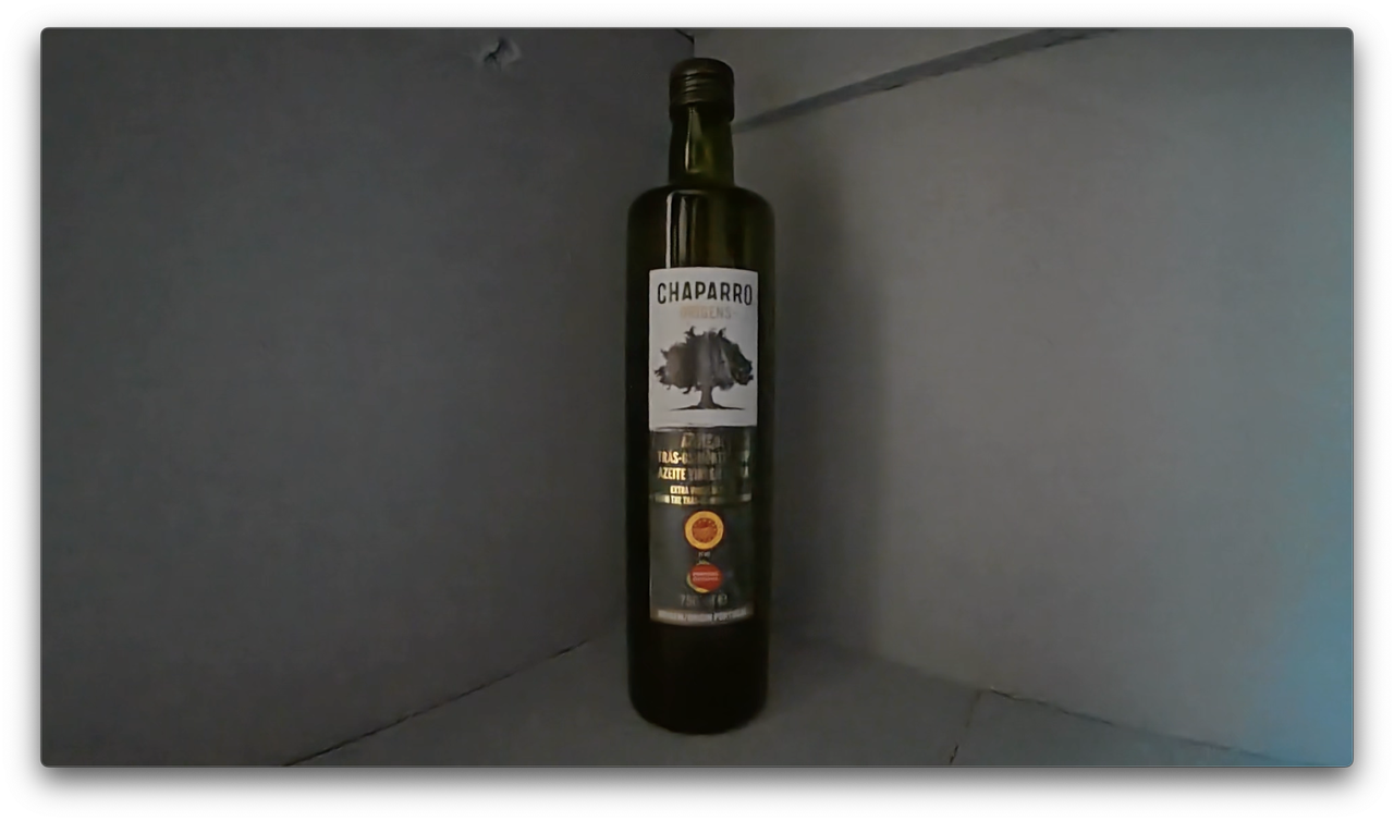 A photo of an olive oil bottle shot, a screengrab from video shot on the DJI Osmo Action 5 Pro