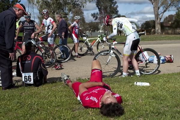 ngus Morton (Drapac Porsche) lies injured with a suspected broken collarbone after a multiple rider pile-up in the home straight.