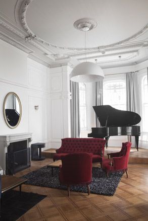 white living space with grand piano