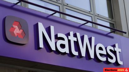 The NatWest logo above a high street branch (Photographer: Hollie Adams/Bloomberg via Getty Images)
